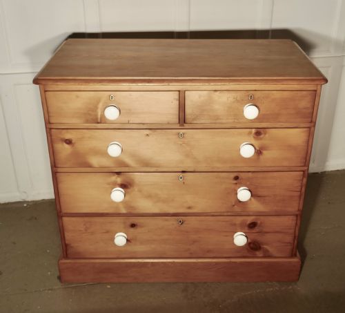 Victorian Pine Chest of Drawers

victorian Pine Chest of Drawers Dates from 1890 It Has Been Stripped and Waxed.
this Is a Very Good Quality Pine Chest, the Large Five Drawer Version Like This One Is Becoming a Lot Less Common These Days and This One Has the Added Advantage of a Very Deep Useful Blanket Drawer at the Bottom.

the Chest Has a Moulded Edge to the Top, It Is in Good Condition, the Drawers All Run Well and Have White Ceramic Knobs 
The Chest Stands 41’’ High, 20’’ Deep and Is 41’’ Wide
tsr133
