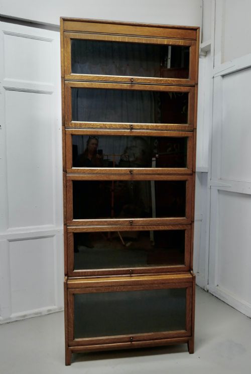 fig 1. A Tall Art Deco Golden Oak Barrister Waterfall Bookcase, made by Gumm