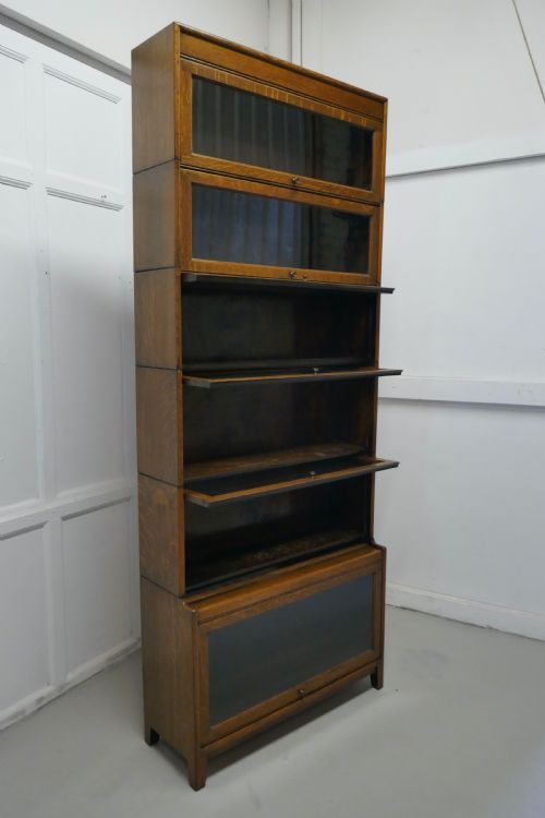 fig 3. A Tall Art Deco Golden Oak Barrister Waterfall Bookcase, made by Gumm