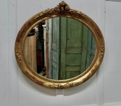 A Large French Rococo Oval Gilt Wall Mirror