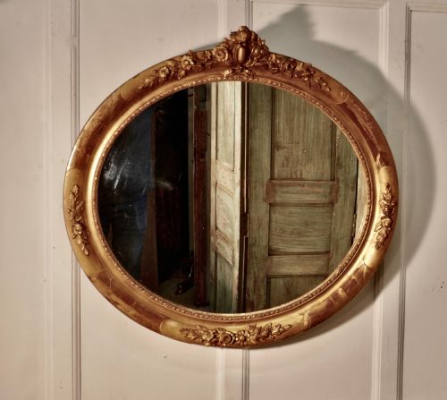 fig 4. A Large French Rococo Oval Gilt Wall Mirror