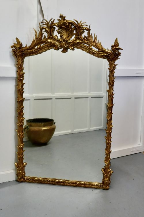 A Large Elaborate French Rococo Gilt Console Mirror Decorated with Leaves and Birds