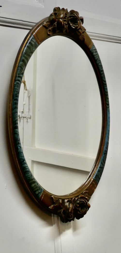 fig 2. A Large Mirror in Oval Ormolu Frame