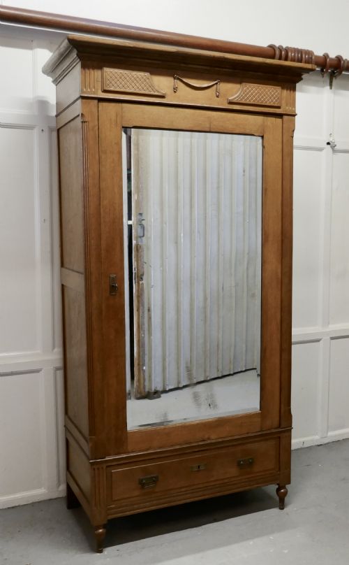 A Victorian Arts and Crafts Golden Oak Mirrored Wardrobe