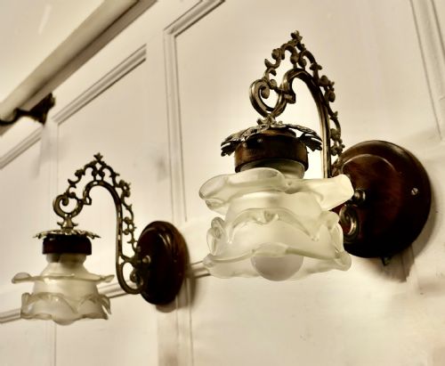 A Pair of French Arts and Crafts Wall Lights with Flower Shades