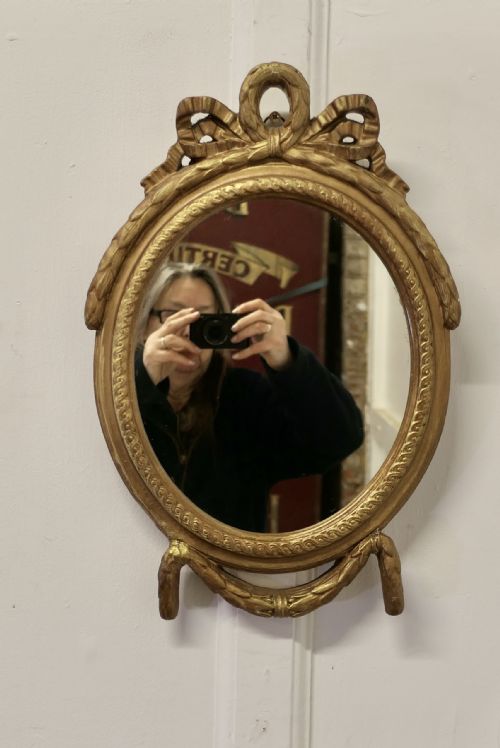 DECORATIVE GILT OVAL MIRROR - ADDITIONAL PHOTO 1