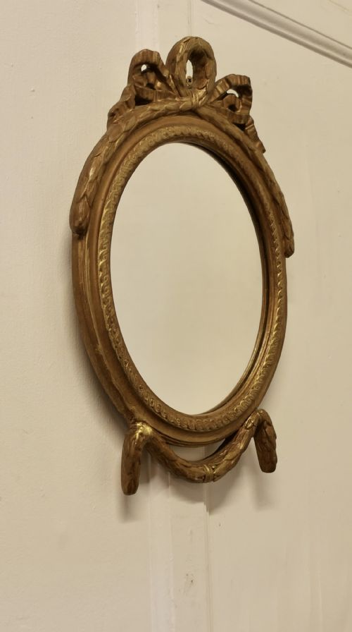 DECORATIVE GILT OVAL MIRROR - ADDITIONAL PHOTO 2