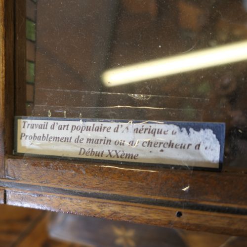 fig 2. An early 20th-century wooden diorama display case featuring a miniature scene of a monkey saloon titled Bills Bar.