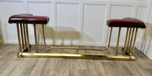 An Extending Brass and Leather Club Fender
