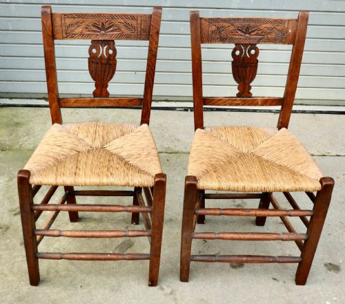A PAIR OF EARLY 19TH CENTURY RUSH SEATED ELM HALL CHAIRS - ADDITIONAL PHOTO 2