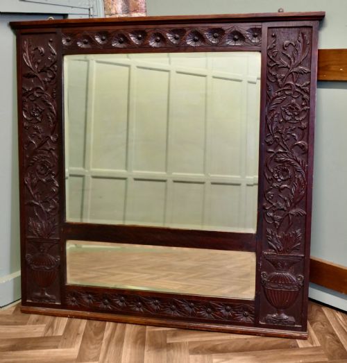 A LARGE CARVED OAK WALL MIRROR - ADDITIONAL PHOTO 1