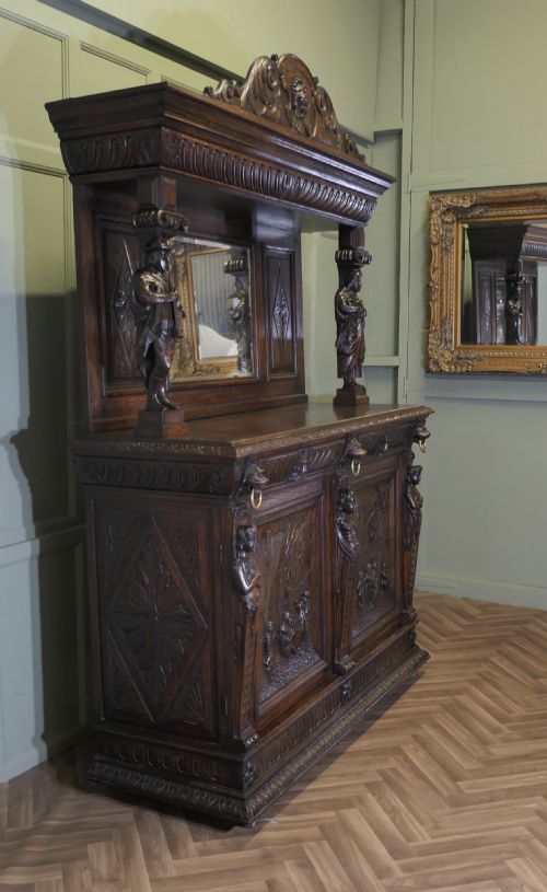 19th Century Carved Oak Mirror Back Dresser with Green Man Carvings
