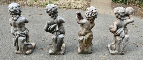 A SET OF 4 WEATHER WORN CHERUB STATUES WITH INSTRUMENTS - ADDITIONAL PHOTO 1