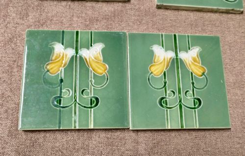 A SET OF 8 ART NOUVEAU EMBOSSED CERAMIC TILES - ADDITIONAL PHOTO 1