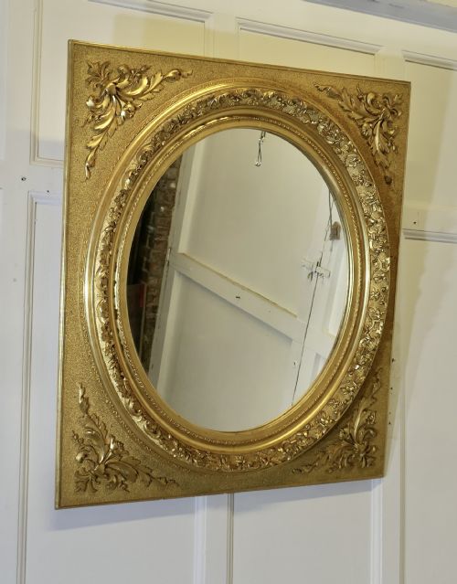 LARGE VERY DECORATIVE GILT OVAL PANEL MIRROR - ADDITIONAL PHOTO 1