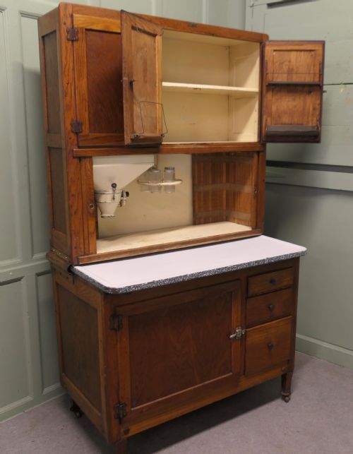 AN AMERICAN OAK HOOSIER KITCHEN CABINET BY HUDSON BROS