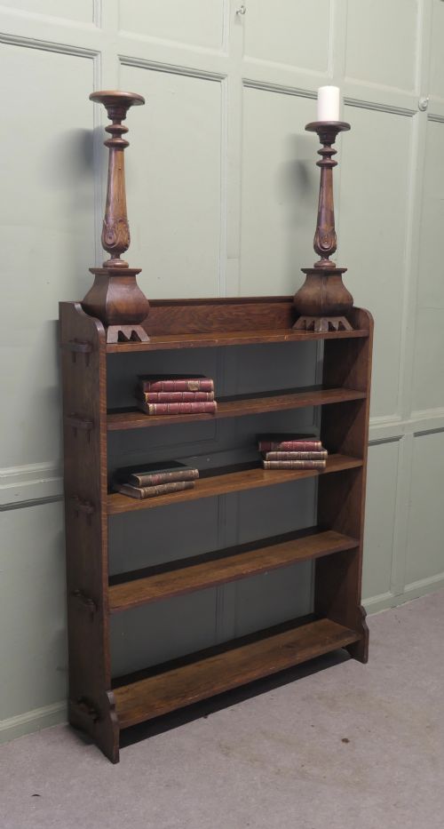 fig 1. An Arts and Crafts oak bookcase featuring five open shelves with prominent exposed side tenons.