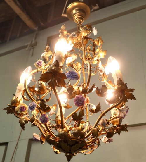 fig 1. A five-bulb French toleware chandelier featuring a gilded metal frame styled with trailing leaves and multicoloured ceramic flower blooms.