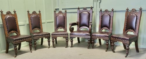 A Set of 6 Gothic Oak High Back Carved Dining Chairs