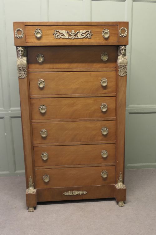 A Tall French Empire Walnut Chest of Drawers in the Neo Classical Style 