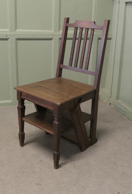 fig 1. An Edwardian metamorphic dark wood chair unfolded into a four-step library ladder.