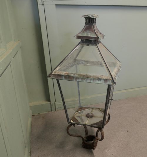 fig 1. A nineteenth-century copper street lantern featuring glass roof panels, a pagoda chimney cap, and a verdigris patina.