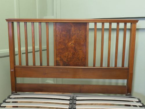 fig 1. An Edwardian burr walnut double bed frame featuring a slatted headboard and footboard centered with figured walnut panels, supported by iron side rails.