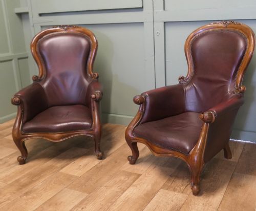 A Pair of Victorian Leather Spoon Back Easy Chairs.