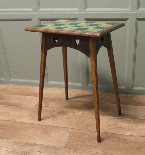 A Liberty London Heart Carved Tiled Top Occasional Table