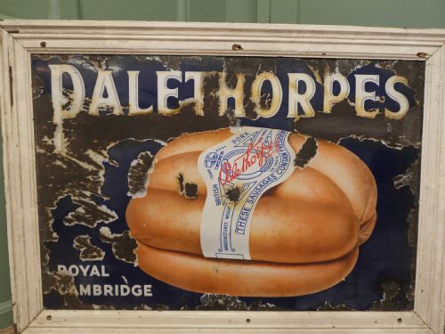 fig 1. A framed antique blue and white enamel advertising sign for Palethorpes Royal Cambridge sausages featuring a central pictorial illustration.