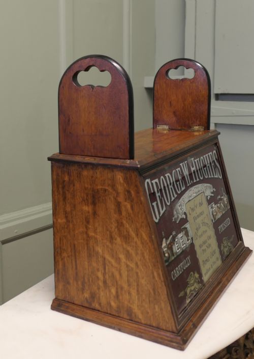 fig 1. A Victorian mahogany shop counter display cabinet with a gilded reverse-painted glass panel advertising George W. Hughes steel pens.