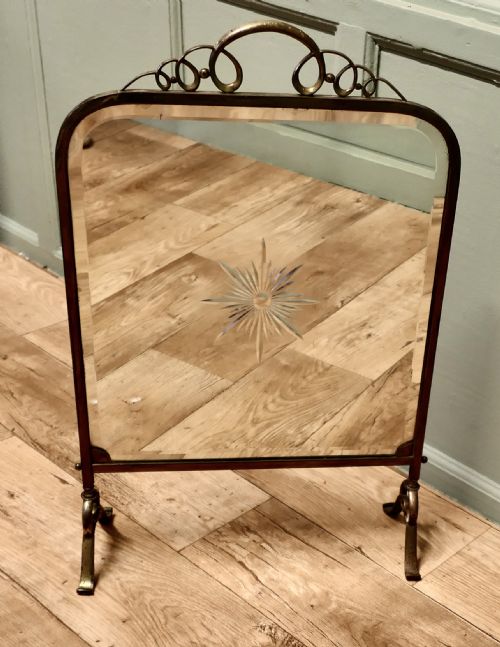 A Fine Quality Art Deco Brass and Sunburst Mirror Fire Screen
