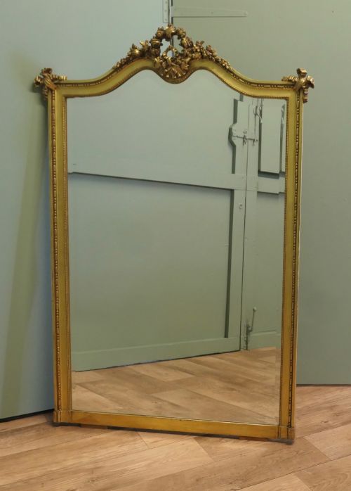 A Large French Rococo Gilt Console Mirror Decorated with Flowers and Ribbons