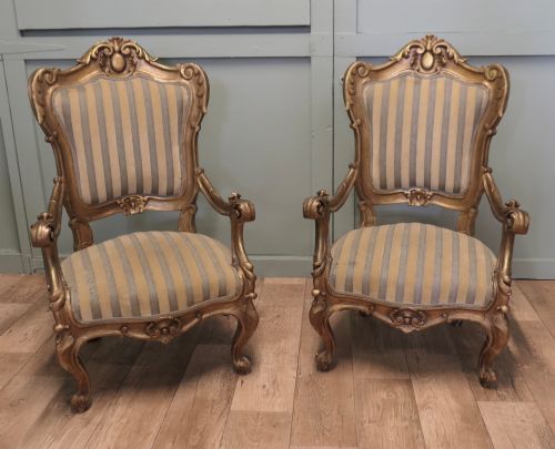 A Stunning Pair of Italian Carved Throne Arm Chairs