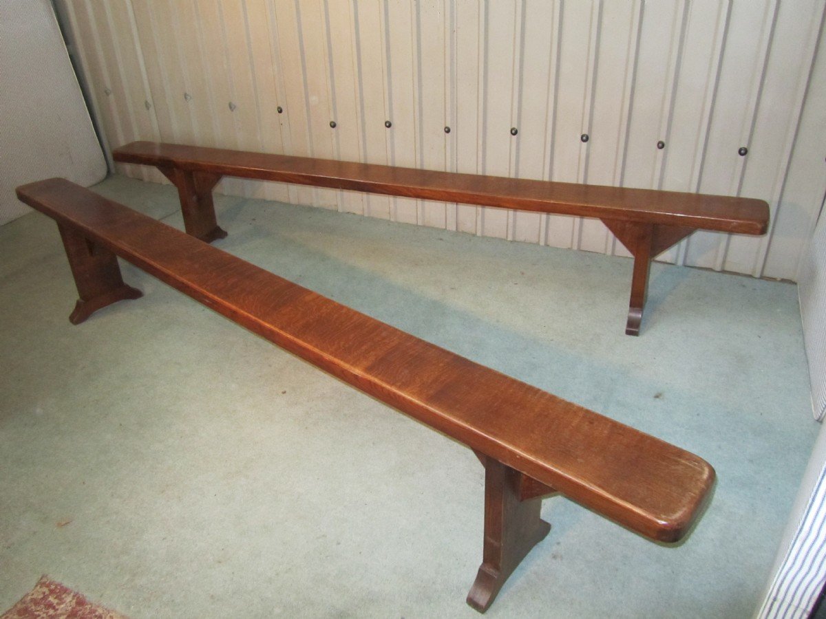 A PAIR OF VERY LONG FRENCH OAK BENCHES