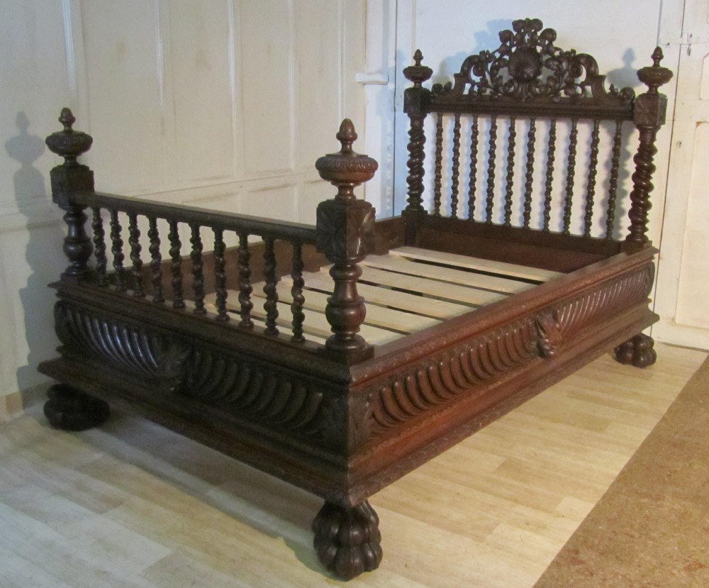 A Heavily Carved French Oak Small Double Bed