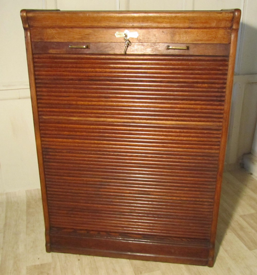 A Large Tambour Fronted Oak Art Deco Filing Cabinet