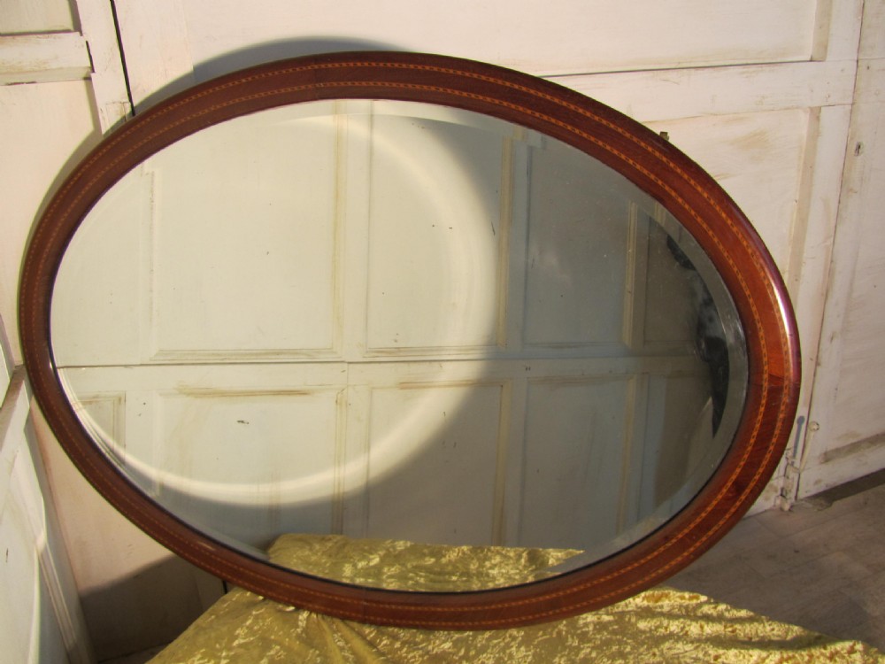 A Very Large Edwardian Inlaid Mahogany Oval Wall Mirror