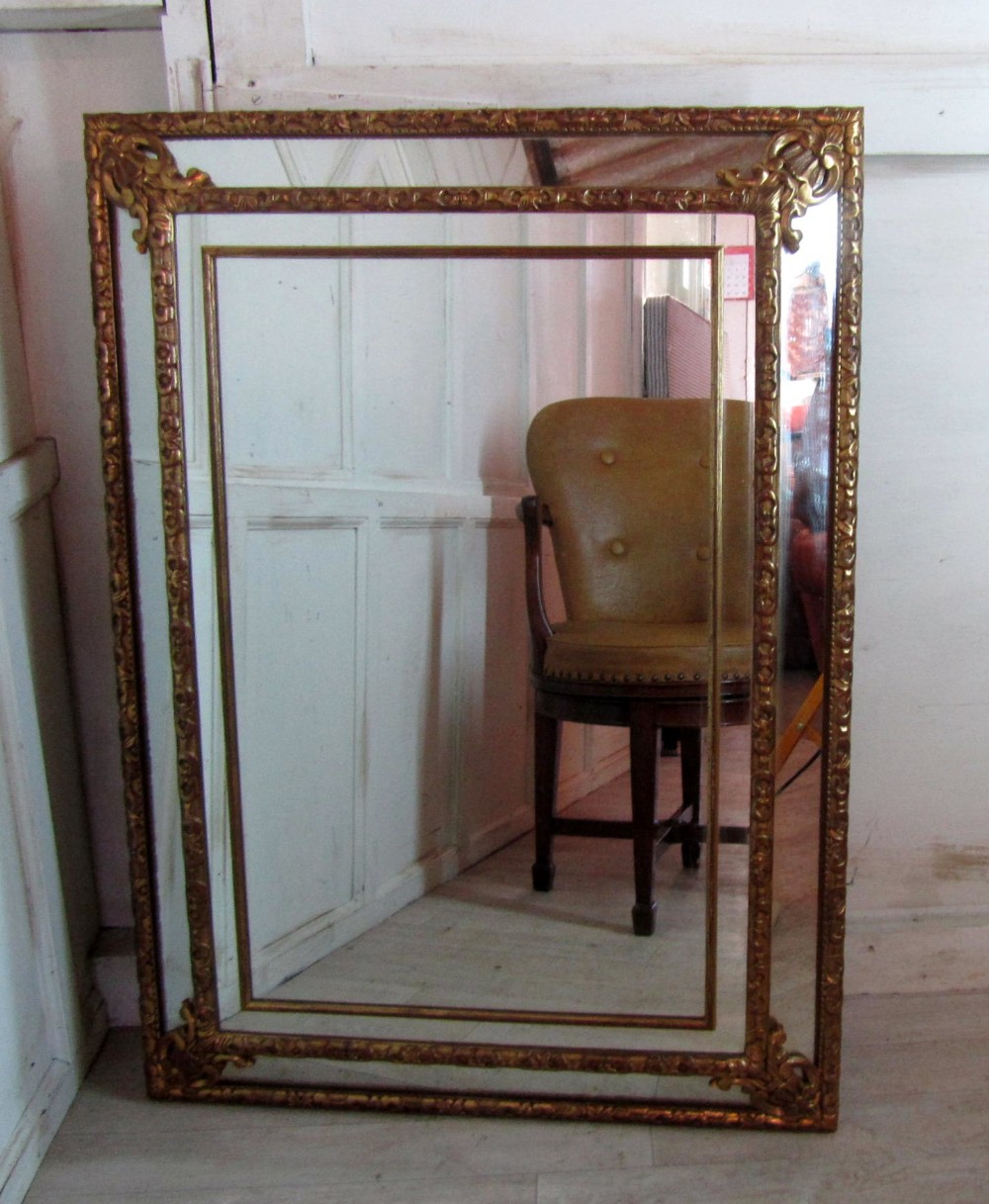 A Large French Gilded Brass Cushion Mirror