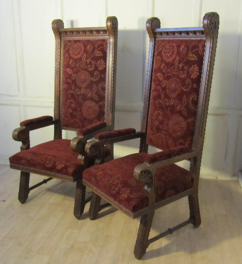 A  Pair of Very Large French Arts and Crafts Carved Oak Throne Chairs.
