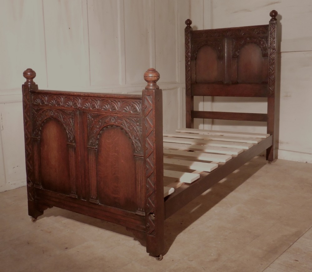 A Superb Victorian Gothic Carved Oak Single Bed