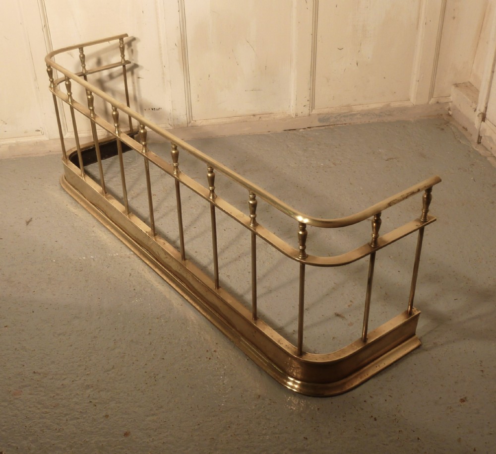 A Large Victorian Brass Club Fender 