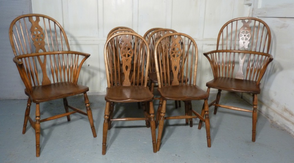 A Set of 8 Elm and Ash Wheel Back Windsor Chairs