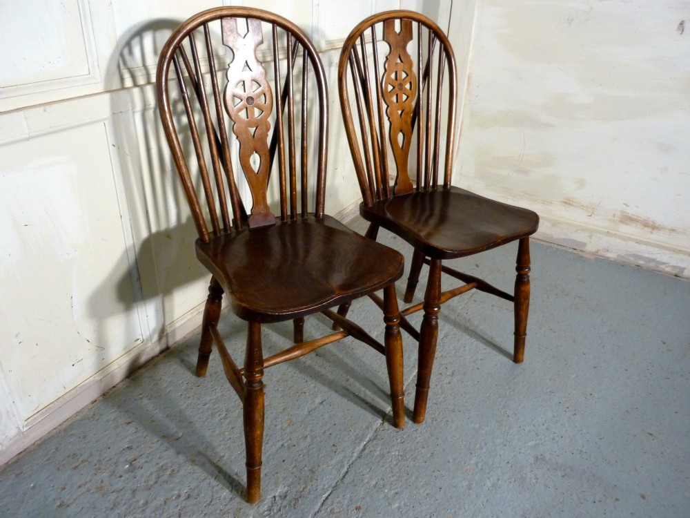 A pair of Victorian Beech & Elm Wheel Back Chairs