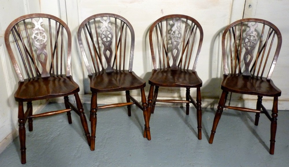 A Set of 4 Beech & Elm Wheel Back Windsor Kitchen Dining Chairs