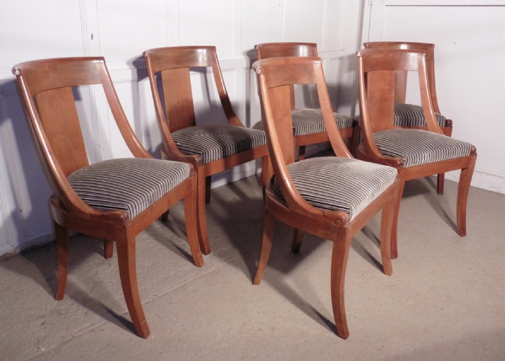 A Set of 6 Art Deco Golden Walnut Dining Chairs
