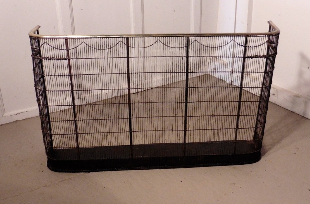 A Georgian Brass and Iron Club Fender or Nursery Fire Guard