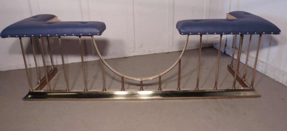A Superb Very Large Brass and Leather Club Fender