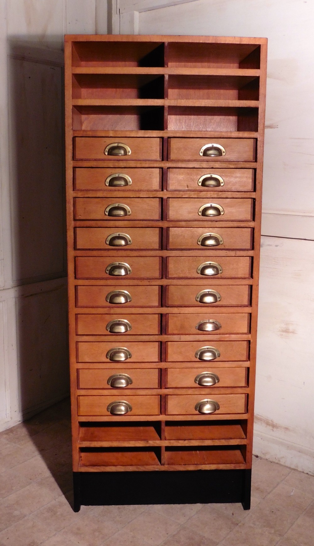 A Tall Art Deco Oak Filing Cabinet, Haberdashers Shelves