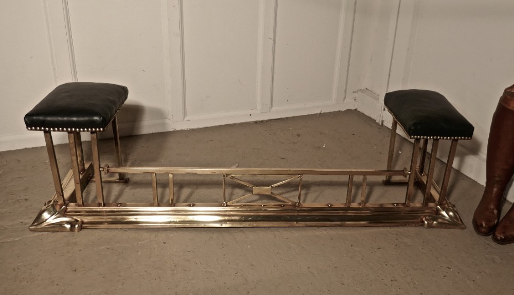 An Art Nouveau Brass and Leather Club Fender